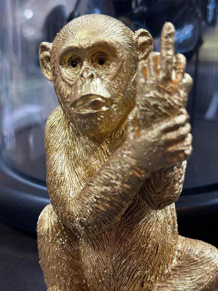 Funny Monkey showing middle finger, golden monkey figure