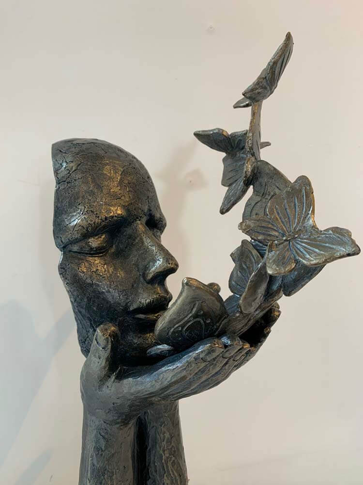 Lady Blowing Butterfly Kisses Sculpture on a Base bronze