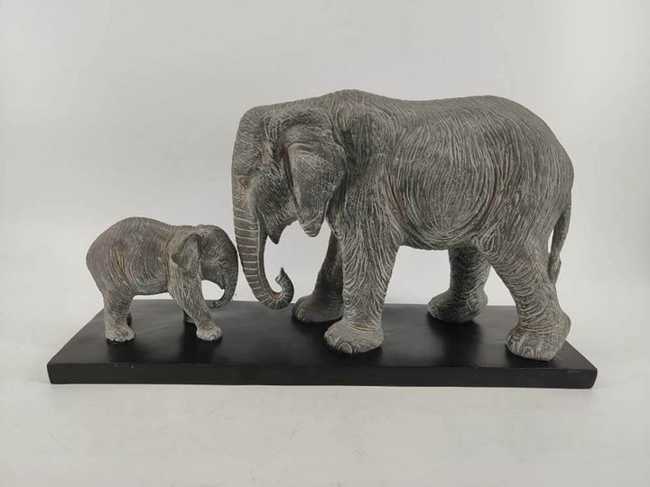 Grey elephant bull and calf statue