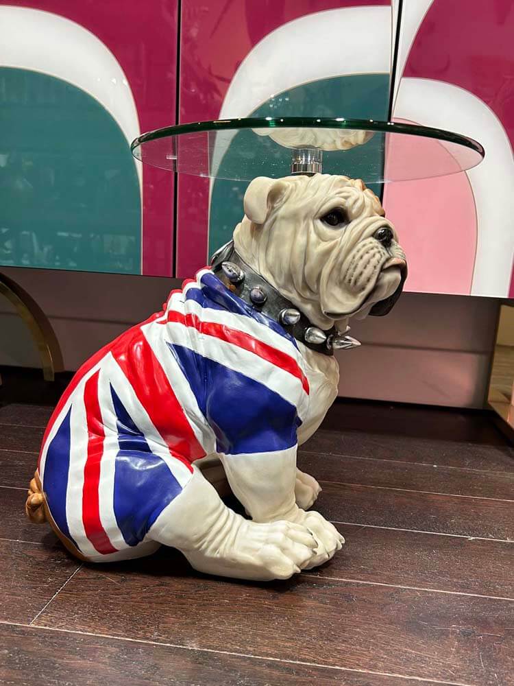 Statue of a bulldog wearing a Union Jack costume glass top side table