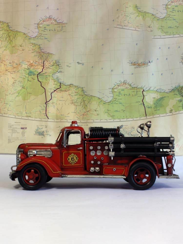 Detailed American fire engine replica with retro styling and authentic features.