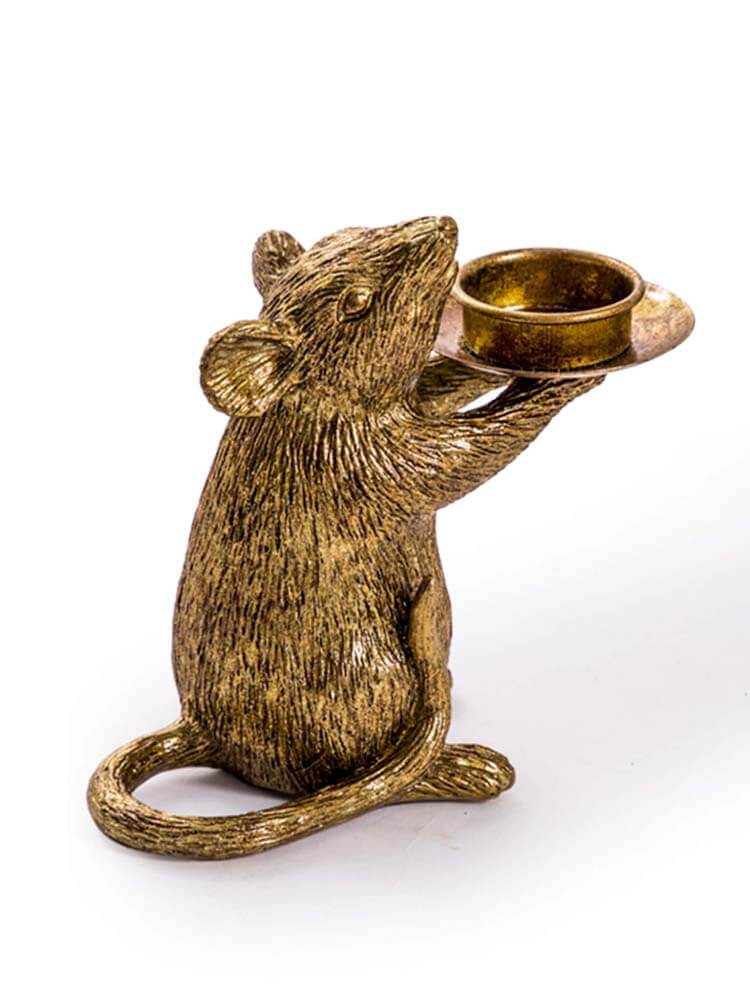 Bronze/gold mouse figurine holding a small candle holder