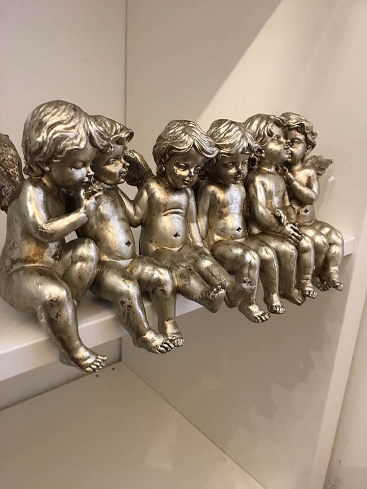 Sitting Row of Cherubs on shelves