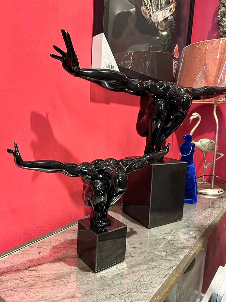 Black resin male man statue arms stretching like a diver 