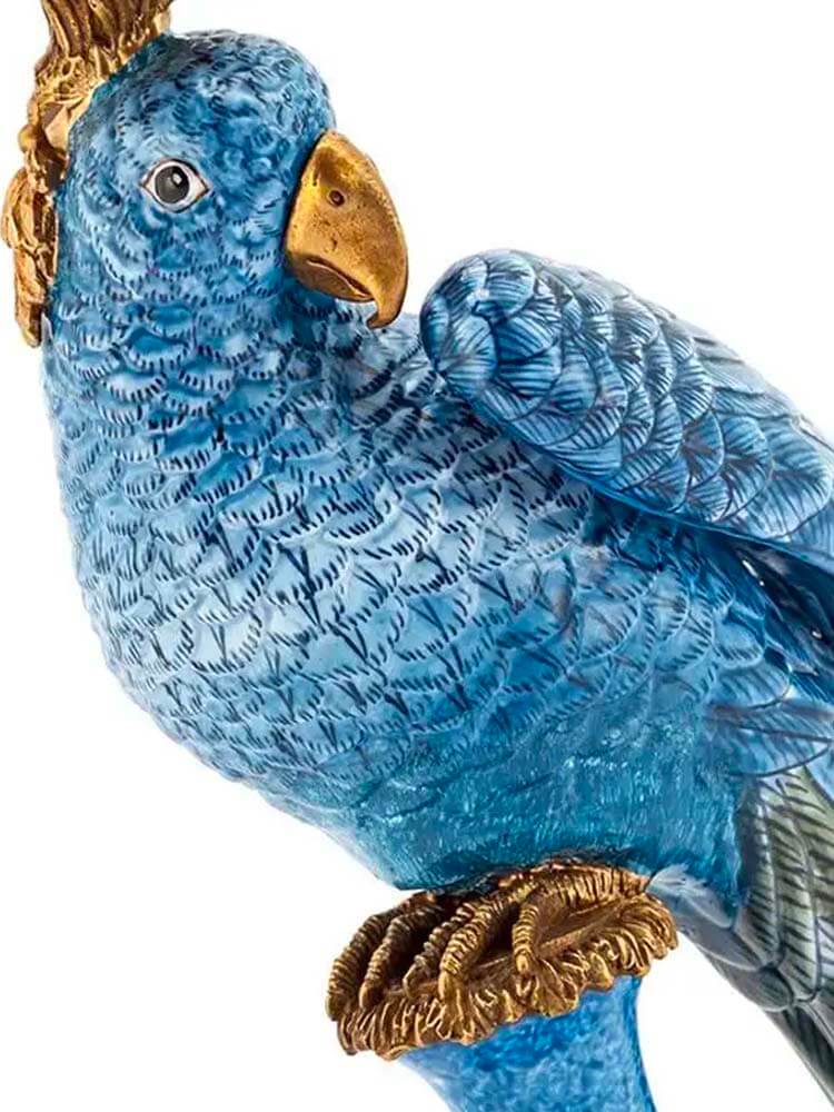 Blue parrot figurine with gold accent 