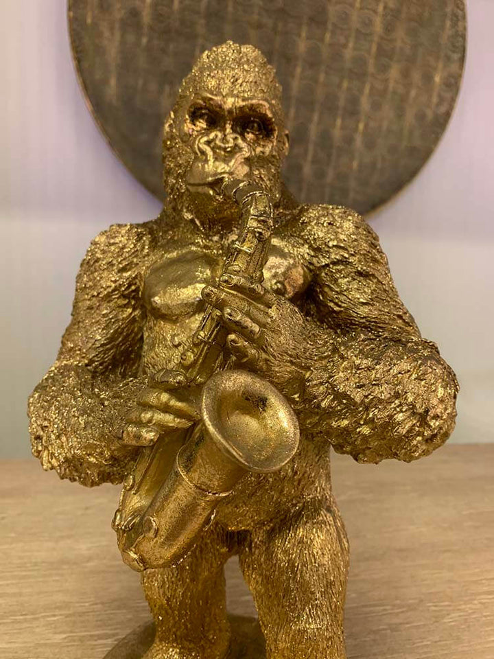 Gold gorilla figurine playing a saxophone, Gorilla Playing Sax gold ornament