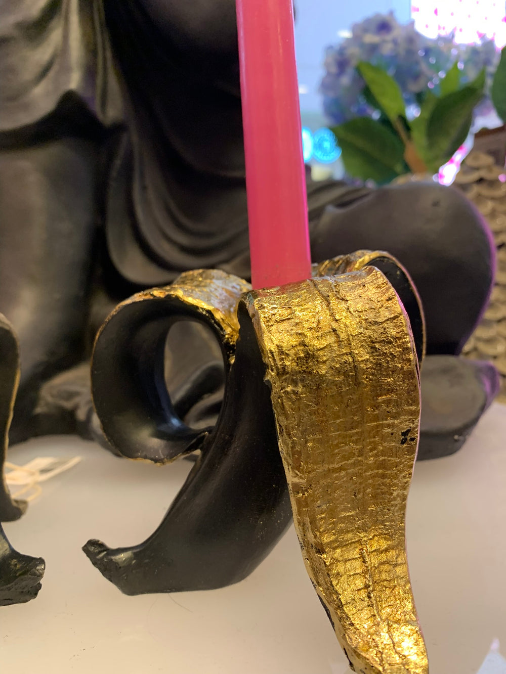 black and gold banana candle holders 