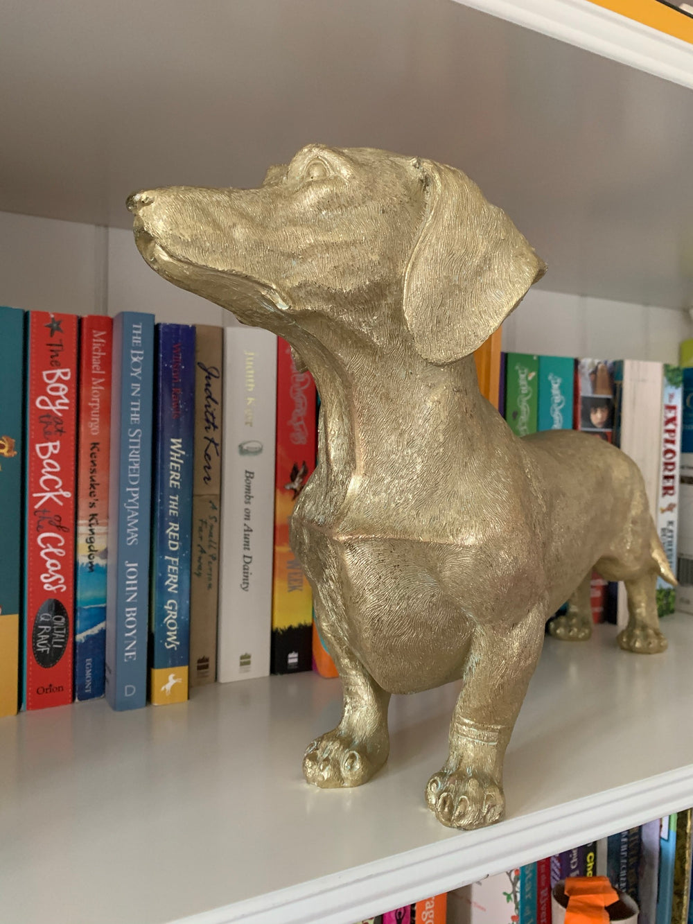 Antique gold sausage dog figuring 