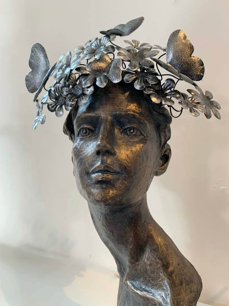 Female face butterflies on her head ornament by The Dutch Hospital 
