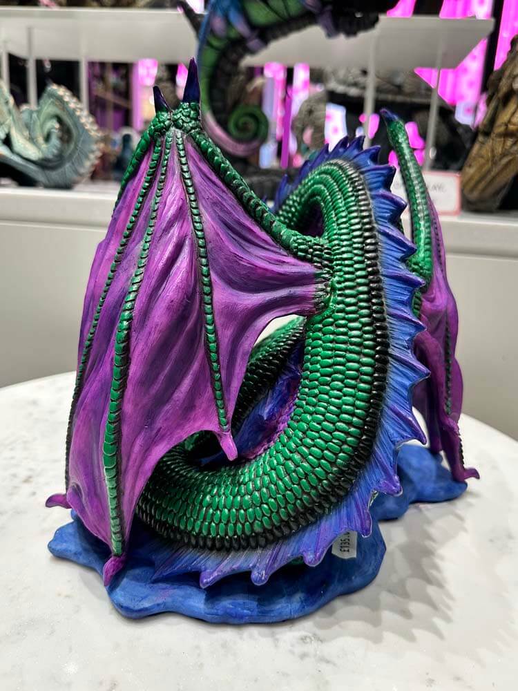Colorful dragon sculpture with purple and green scales