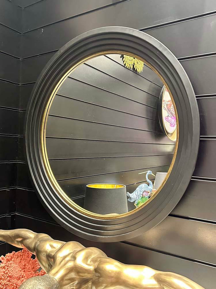 Round mirror with a decorative black frame, Large round step-framed wall mirror with a matte gold leaf finish