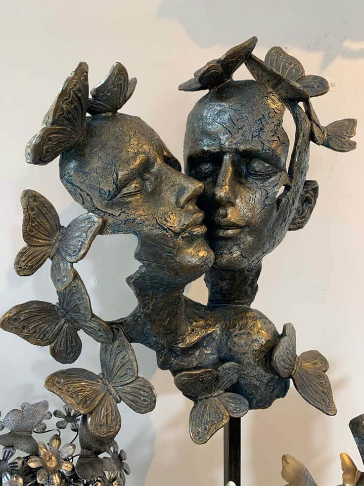 Two Human faces, Male and Female Faces With Butterflies on a Base Sculpture 