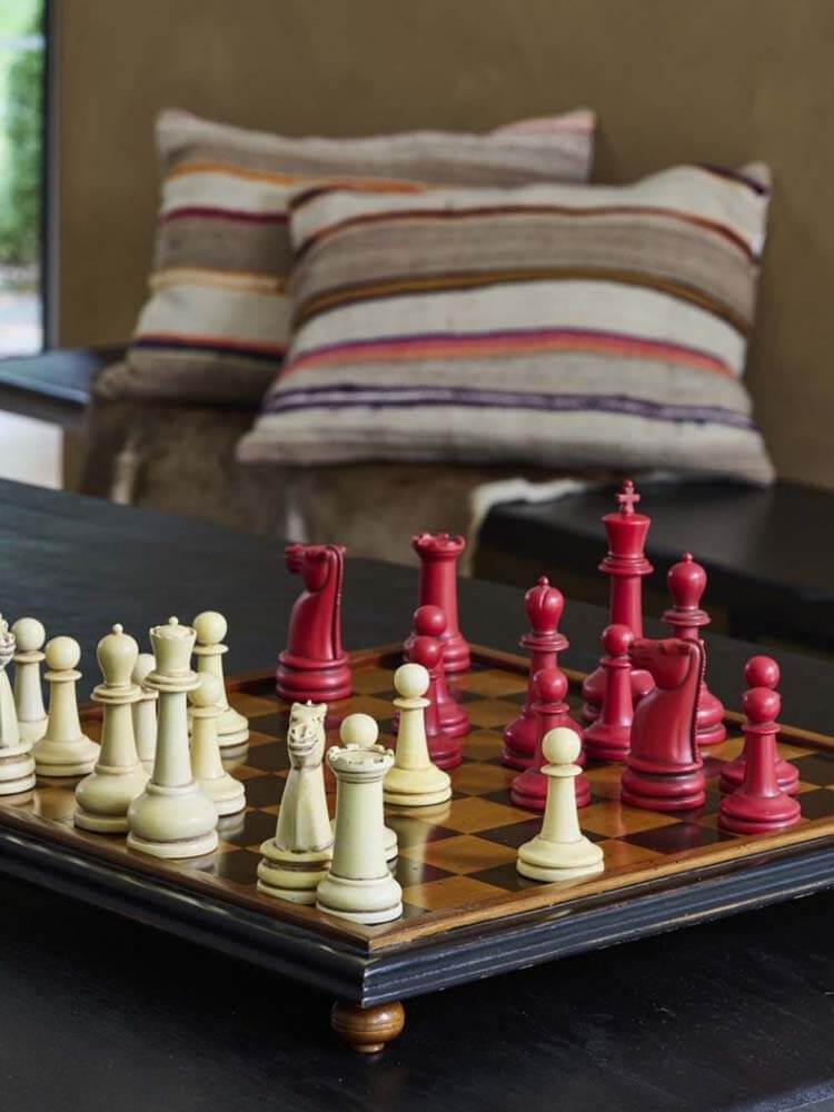 Chessboard with red and white chess pieces