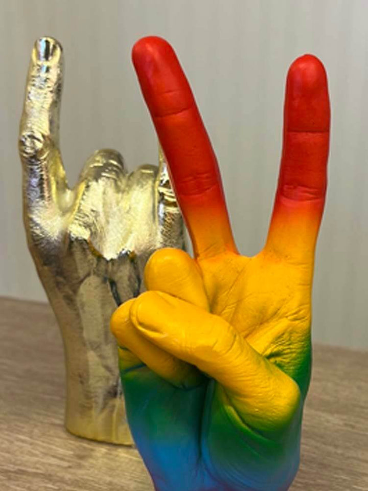 Add a touch of fun and positivity to any space with this Peace Sign Hand Gesture Sculpture. Freestanding and crafted from durable polyresin.