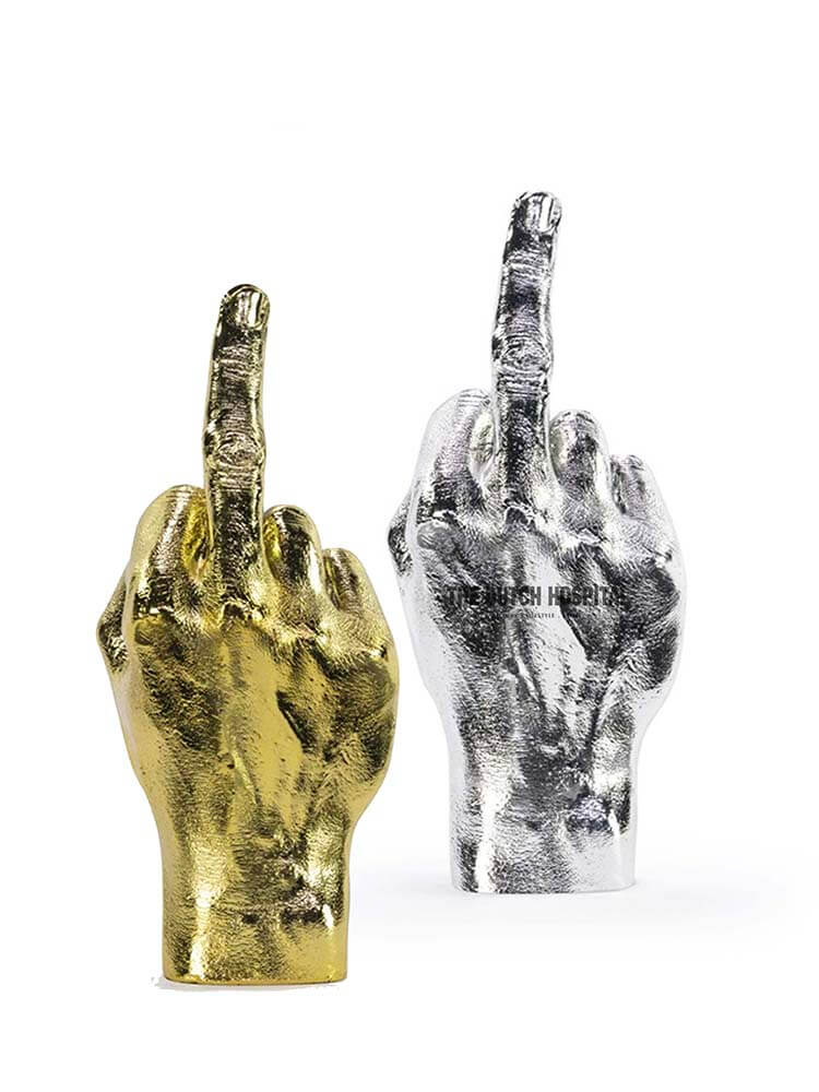 gold and silver hands, gold middle finger, silver hand jewellery holder