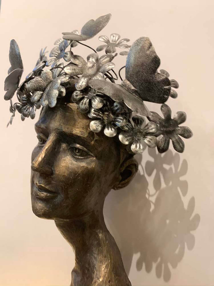 Female face butterflies on her head 