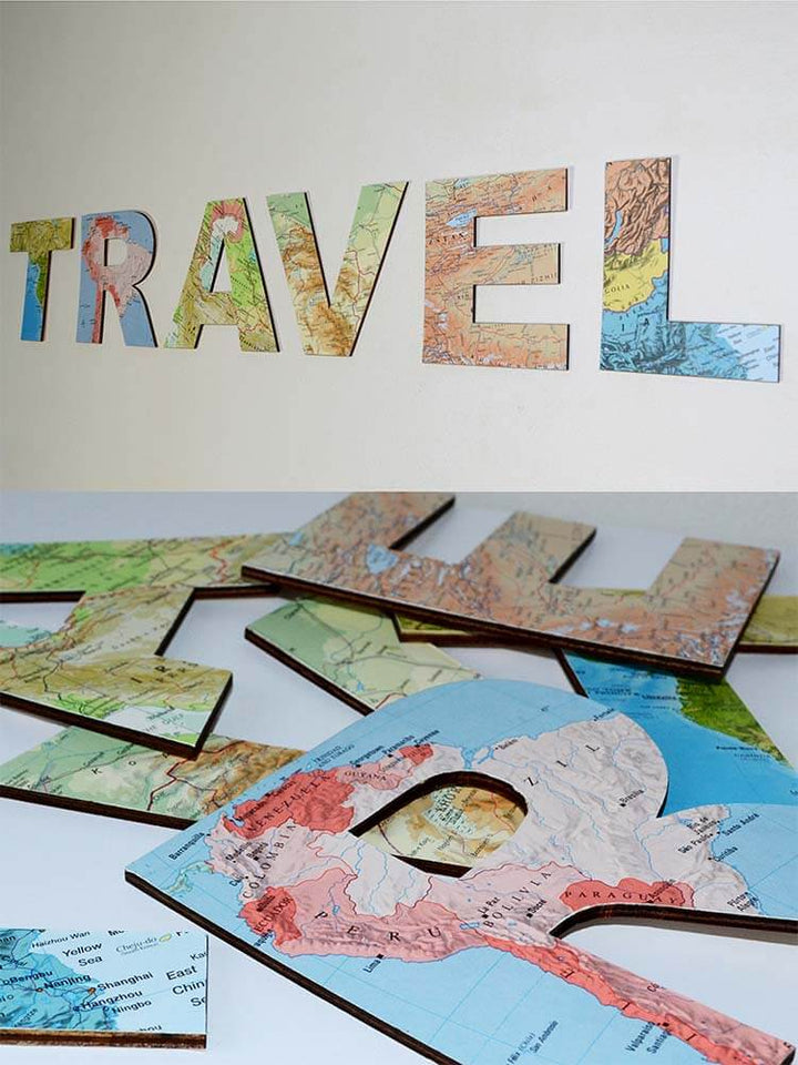 Map-themed letters spelling 'TRAVEL'  