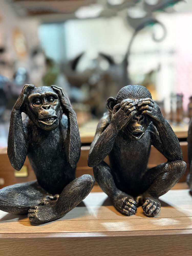The Dark Bronze 3 Wise Monkeys set features figurines of the well-known trio depicting "Hear No Evil, See No Evil, Speak No Evil."