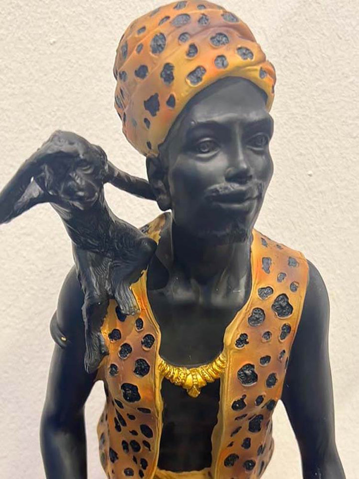 Beautiful black beard turban man Indian African catching monkey