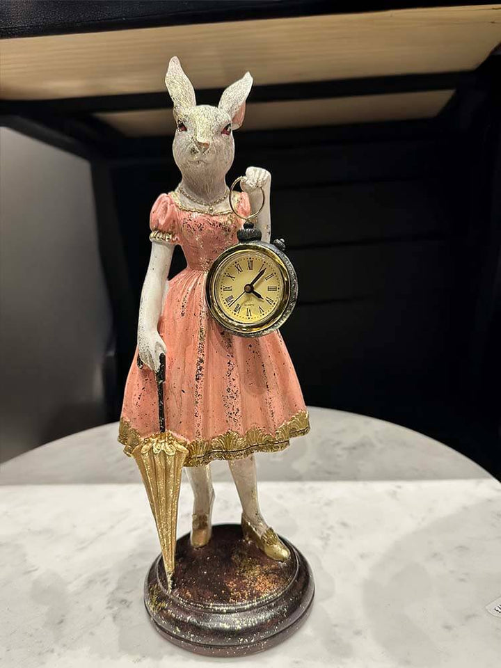 Lady rabbit holding a pocket watch and gold umbrella, pink dress and glitter look. 