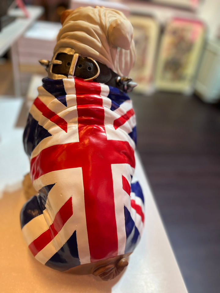 Large sitting English bulldog in Union Flag coat