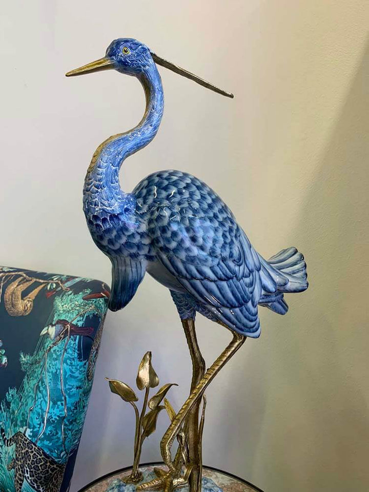 Blue heron ornament crafted from porcelain with bronze and marble details 