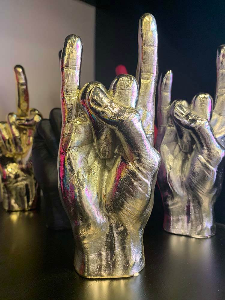 Rock you hand statue in silver