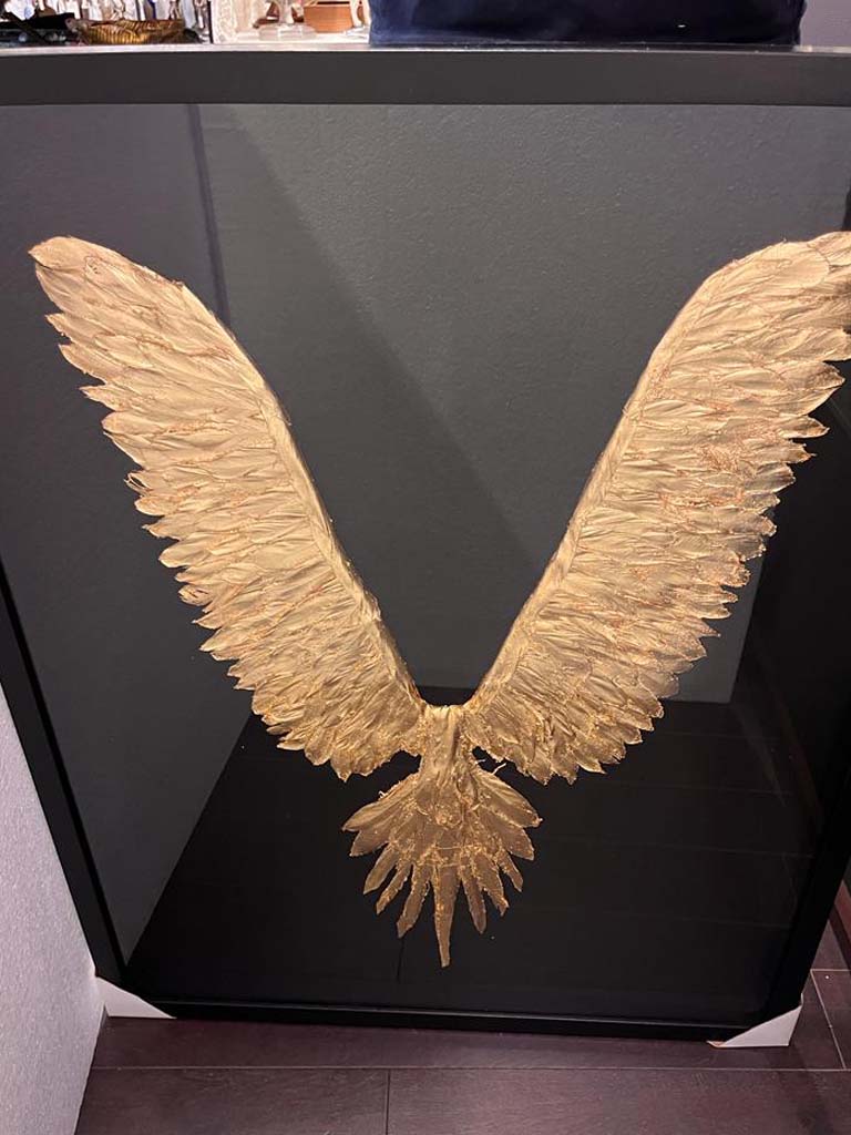 black wall art, gold and black angel wings