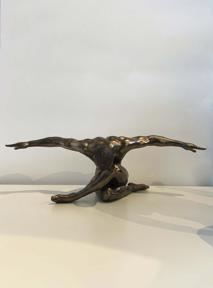 male-nude-arms-outstretched-oversized-sculpture-nude-female-figurine-crouching-nude-bronze-sculpture